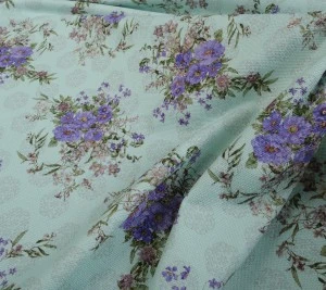 Tweed sygnowany Emanuel Ungaro - kwiaty na miętowym tle 