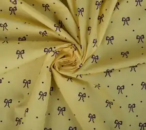 Bawełna popelina - kokardki na żółtym tle